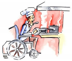 A woman cooking at an accessible stovetop.