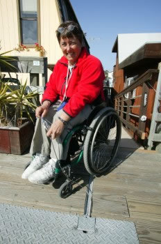A female wheelchair user about to go kayaking.