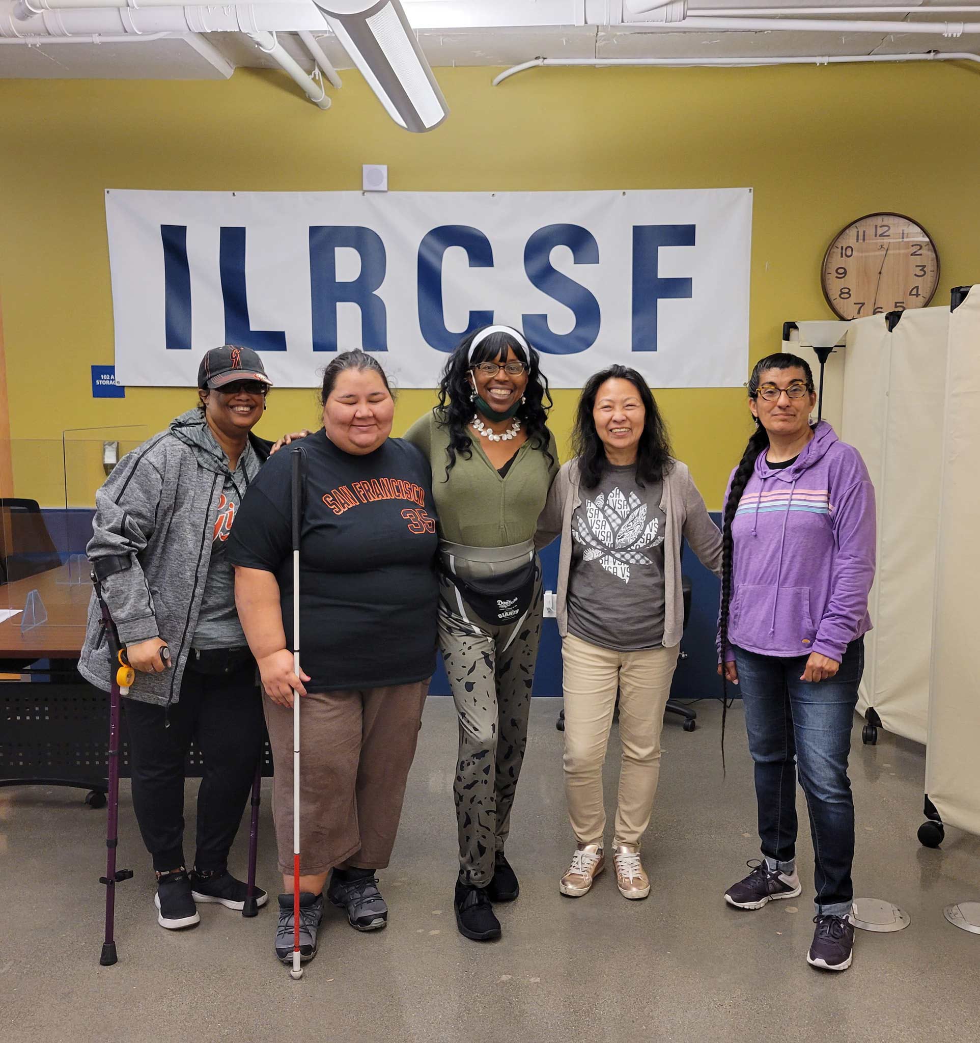 Group of women in front if ILRCSF sign